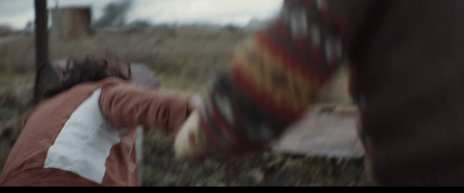 a blurry photo of a person walking in a field