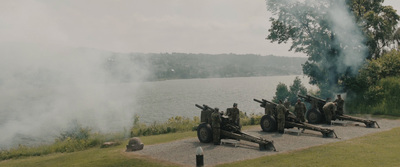 a group of cannons with smoke coming out of them