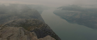 an aerial view of a mountain and a river