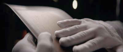 a close up of a person holding a book