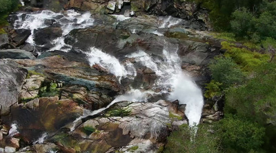 a large waterfall with lots of water coming out of it