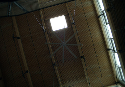 a ceiling with a clock and a window in it