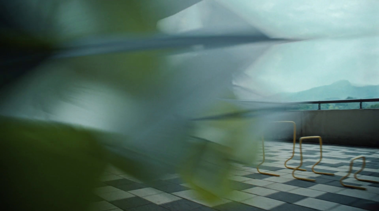 a couple of chairs sitting on top of a tiled floor