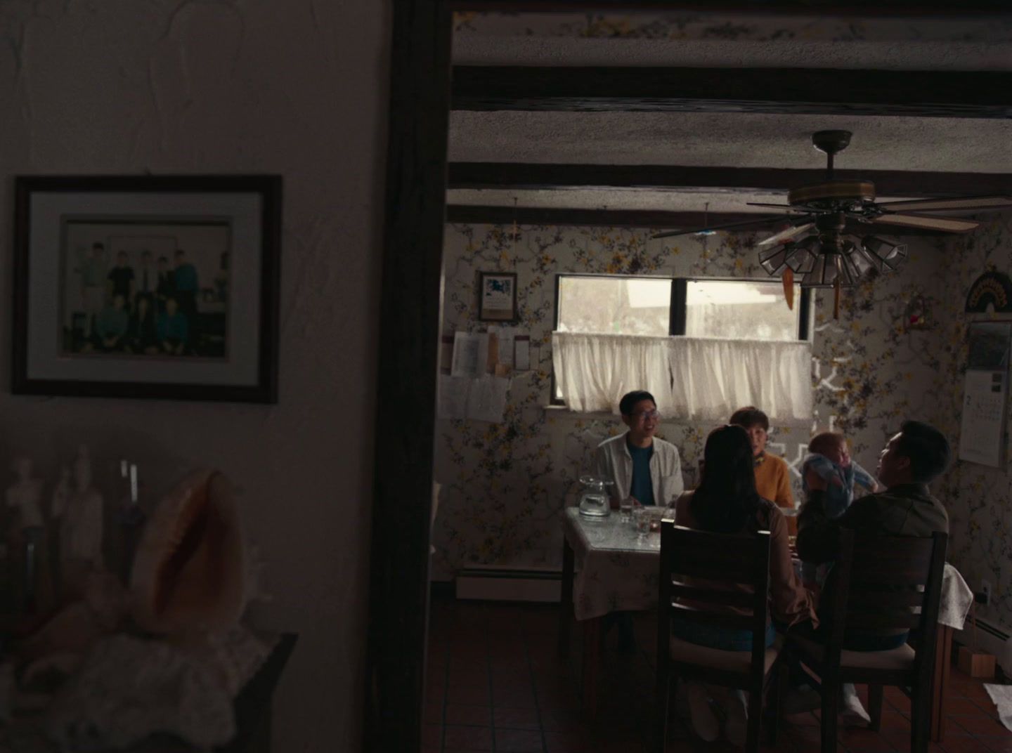 a group of people sitting around a dining room table