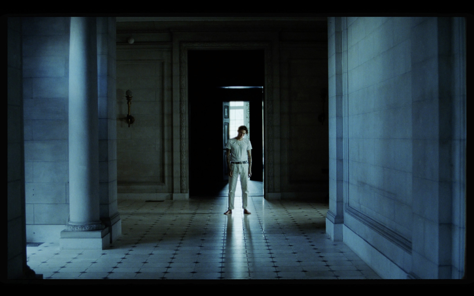 a woman standing in a doorway of a building