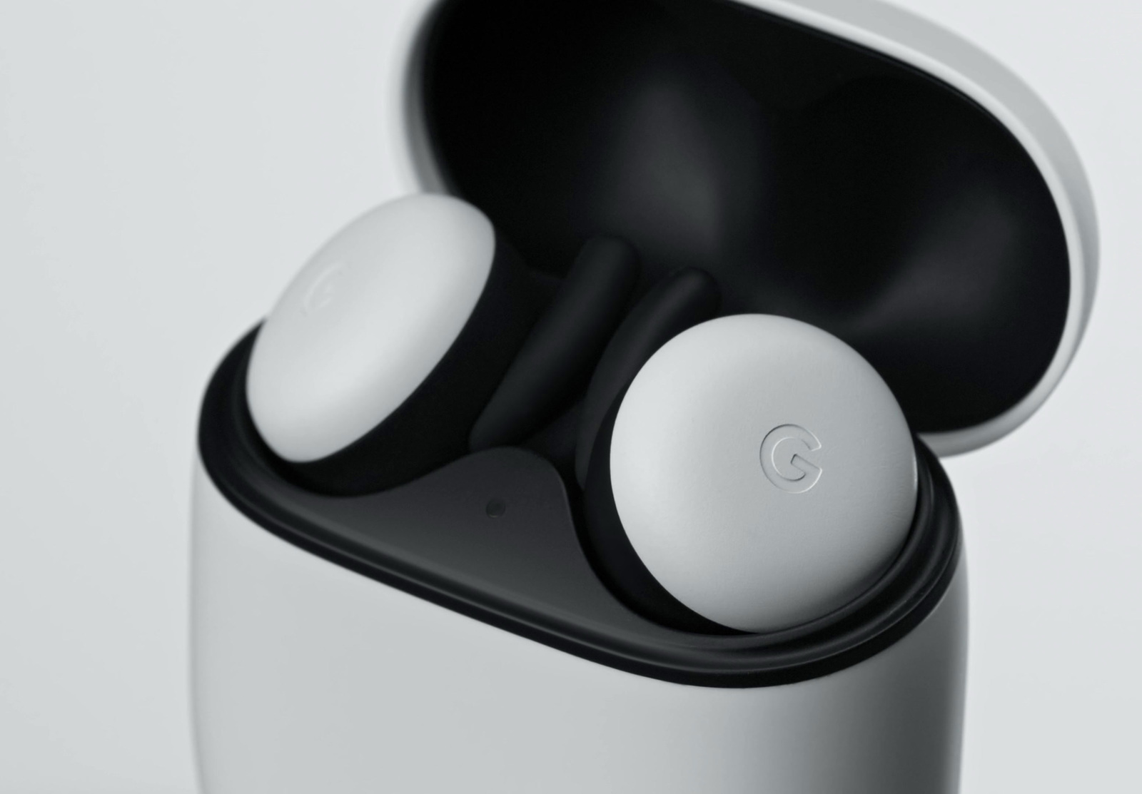 a close up of a pair of earbuds in a case