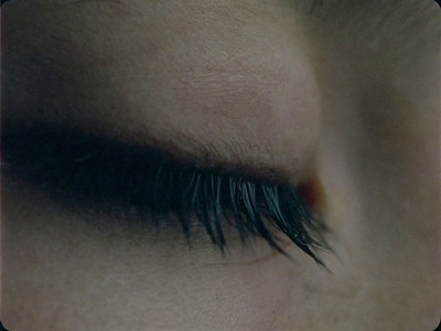 a close up of a person's eye with long lashes