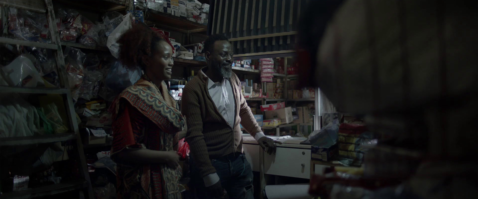 a man and a woman standing in a store