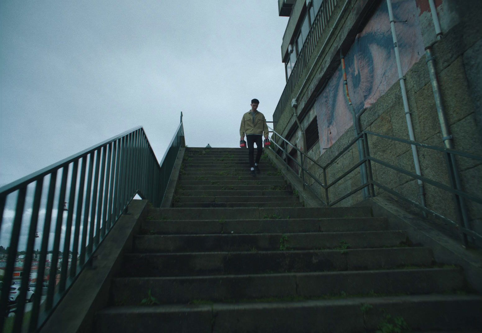 a man walking up a flight of stairs