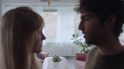 a man and a woman sitting at a table