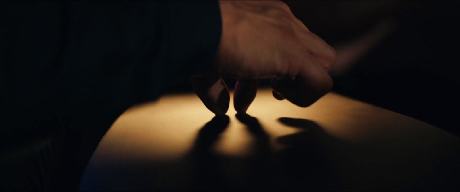 a person touching a table with their hands