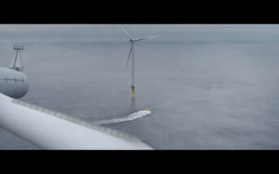 a wind turbine in the middle of the ocean