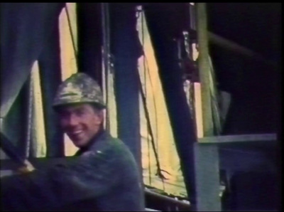 a man wearing a helmet and holding a baseball bat