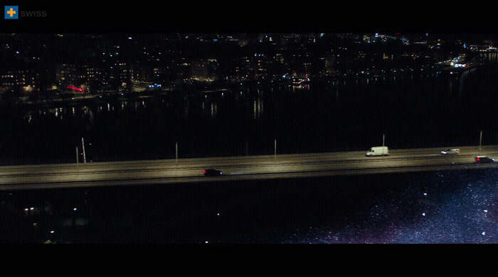 a night time view of a highway and a bridge