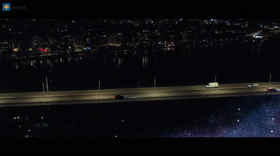 a night time view of a highway and a bridge