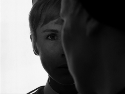 a young man is looking at himself in the mirror