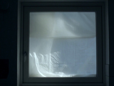 a window with a white sheet covering it