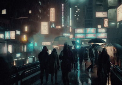 a group of people walking down a street at night