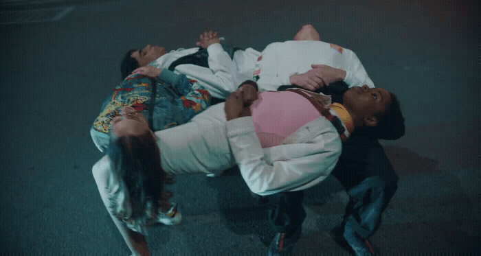 a group of people laying on top of each other