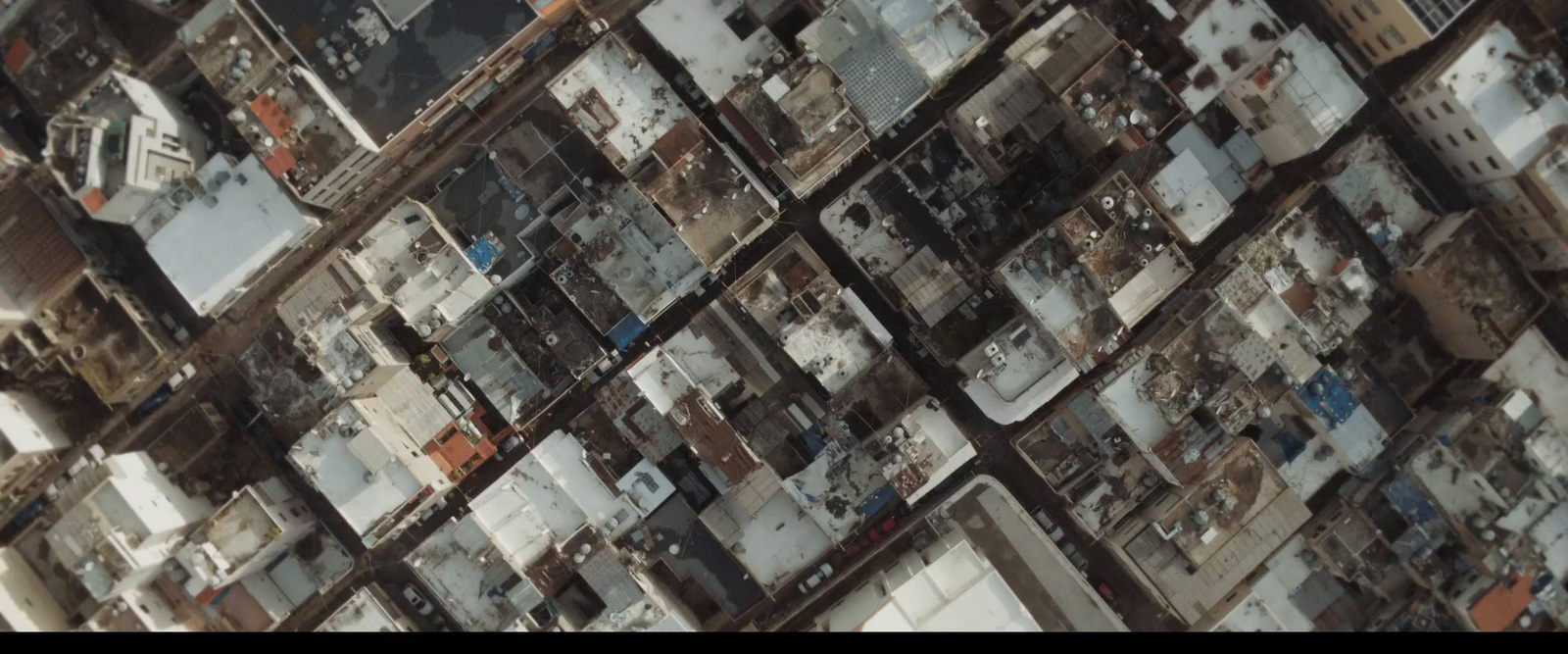 an aerial view of a building with lots of windows