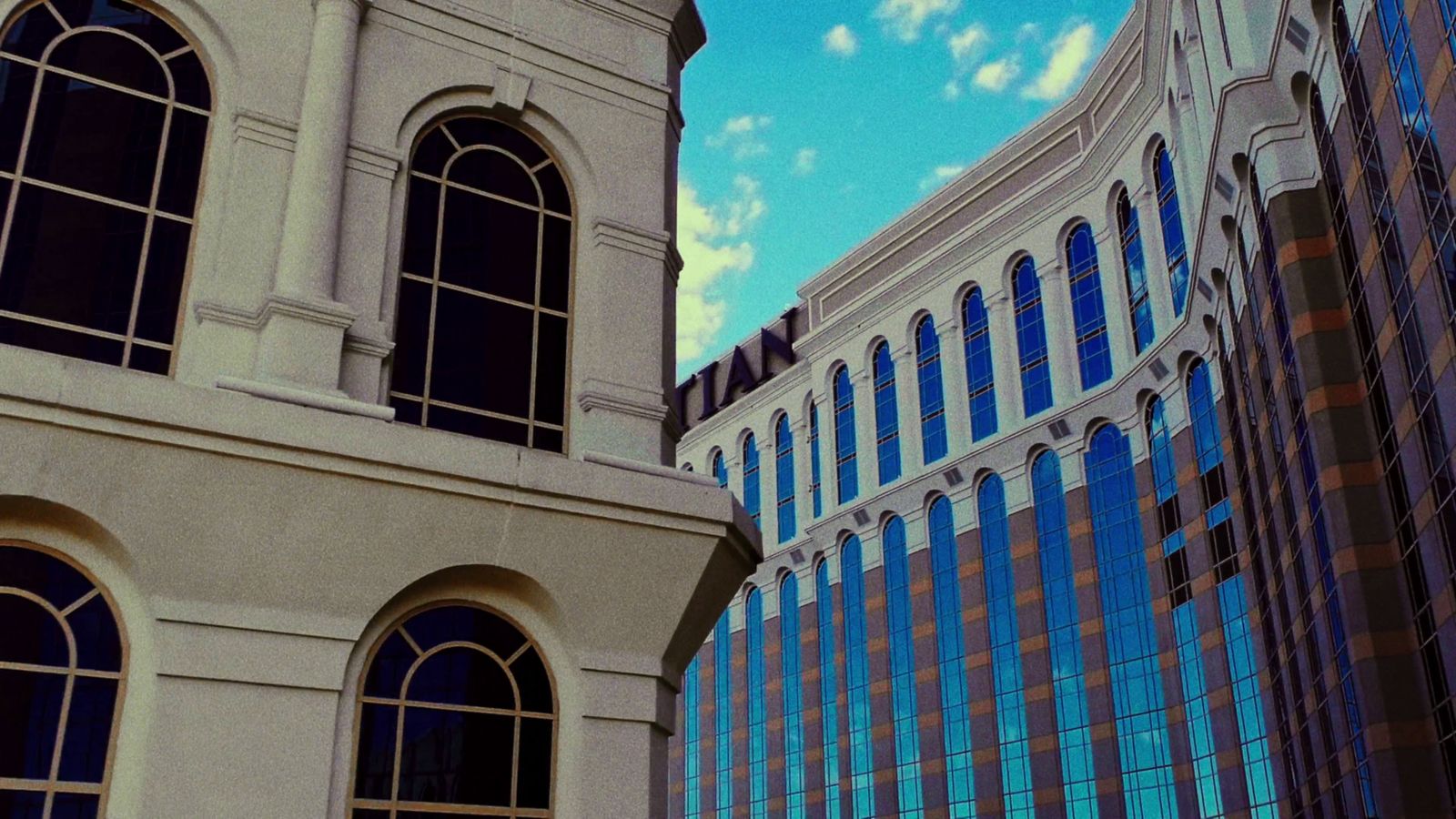 a large clock tower next to a tall building