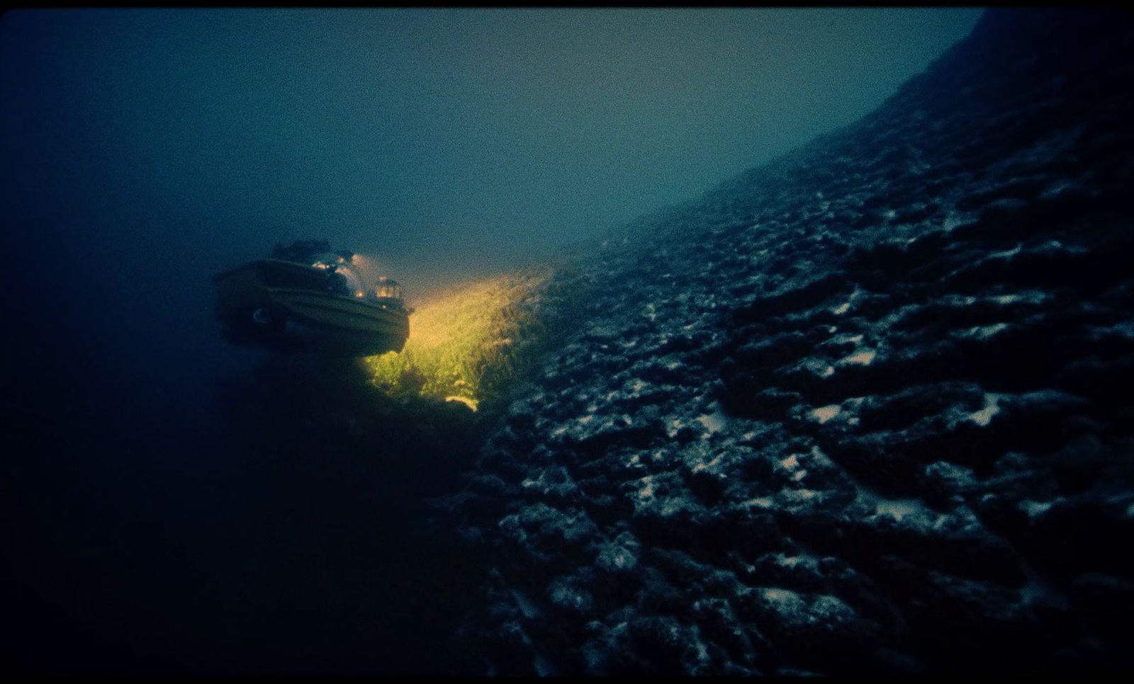 a small boat floating on top of a body of water