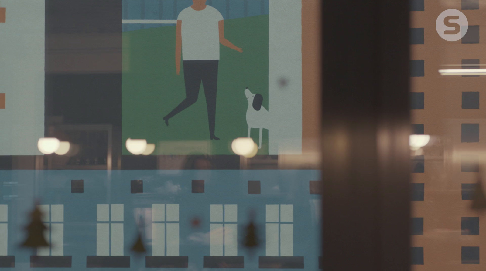 a picture of a man walking a dog through a window