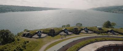 an aerial view of a fort on a hill overlooking a body of water