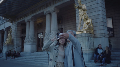 a woman taking a picture with her cell phone