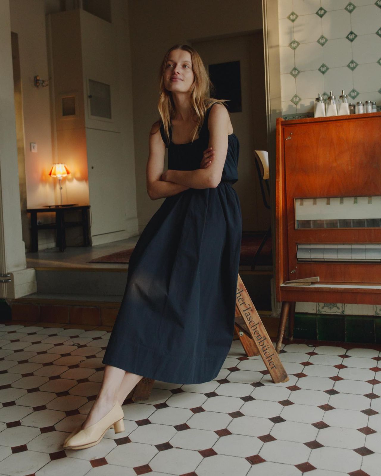 a woman sitting on a chair in a room