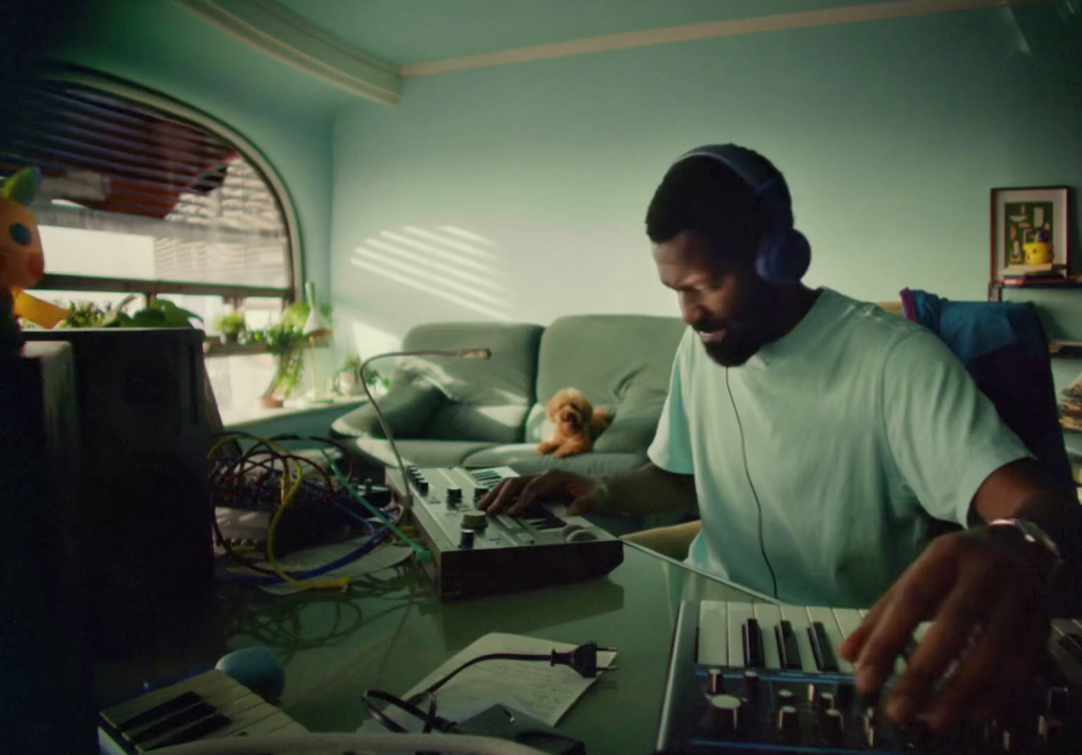 a man sitting at a table with headphones on