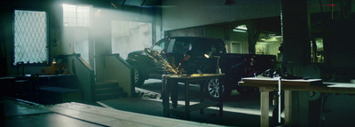 a car parked inside of a garage next to a table