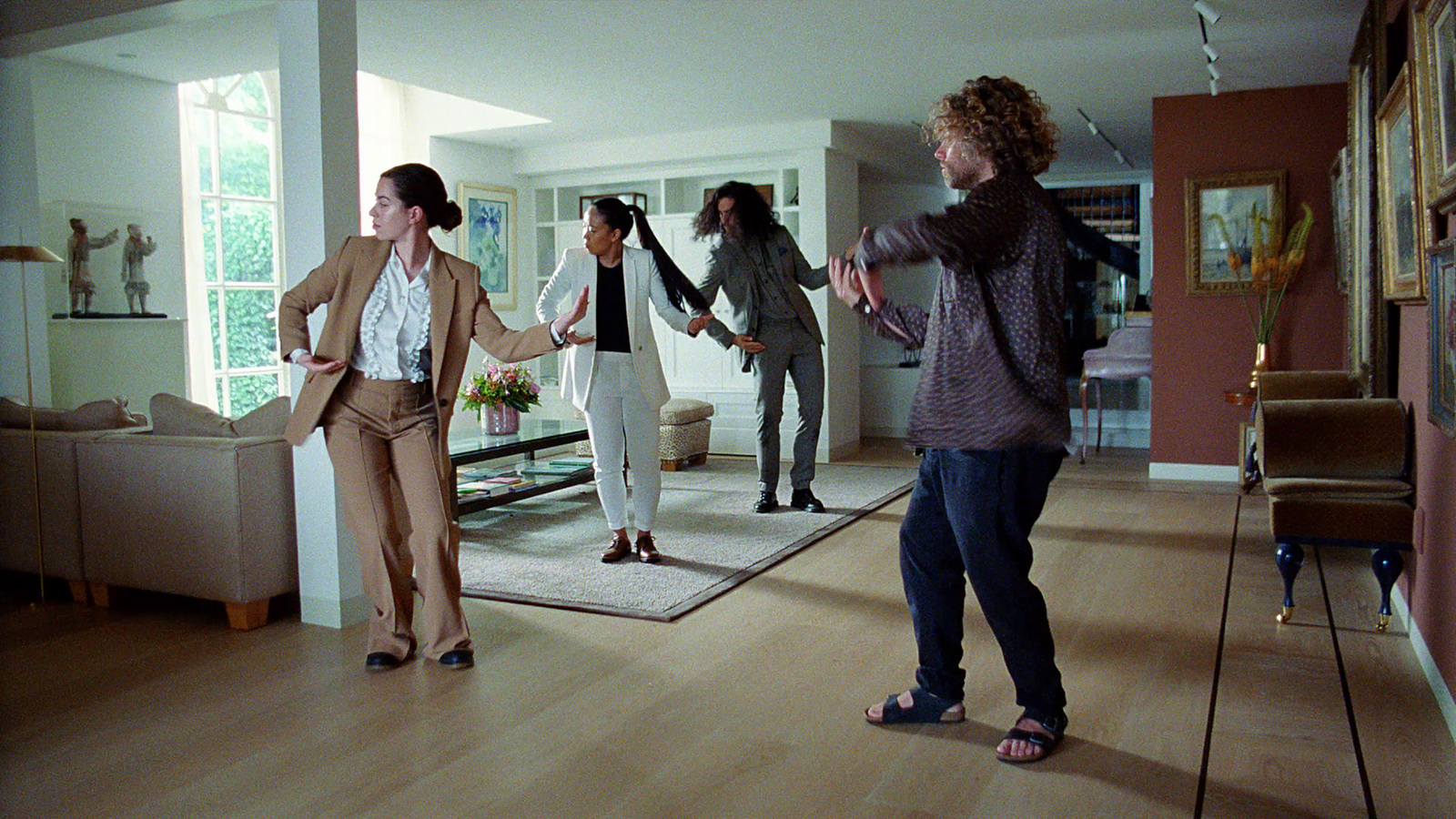 a group of women standing in a living room