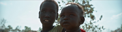 two young boys standing next to each other