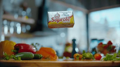 a can of sprolle sitting on top of a cutting board