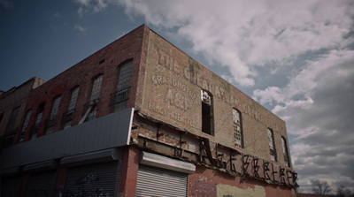 an old building with graffiti on the side of it