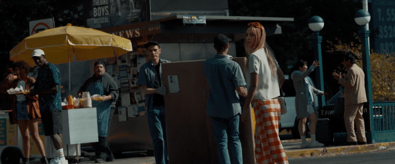 a group of people standing on the side of a road