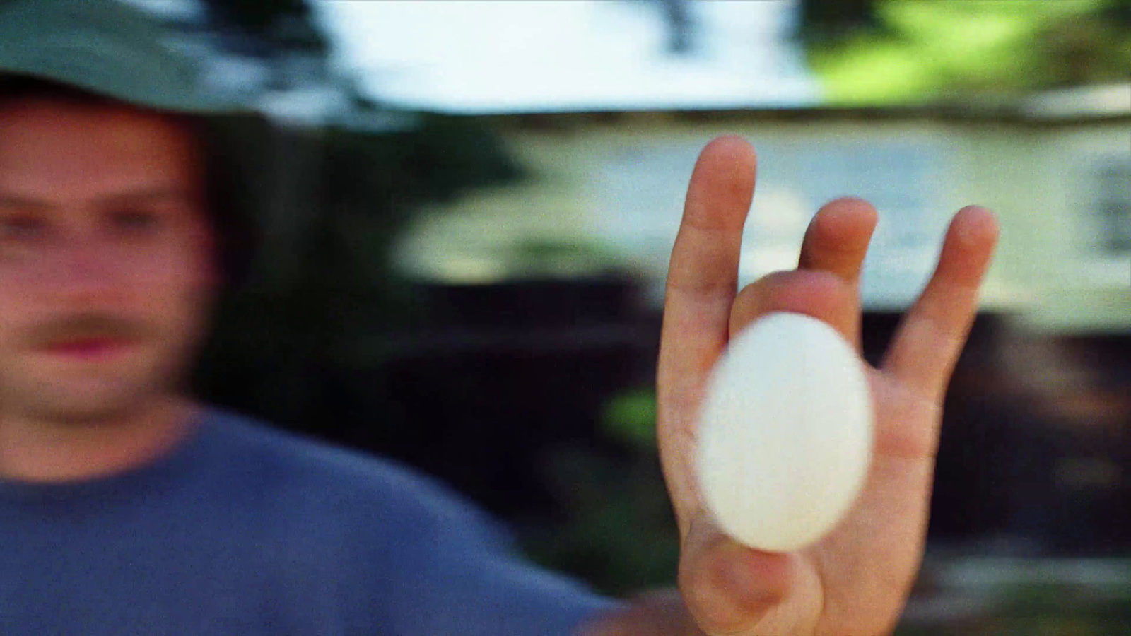 a man holding a white object in his hand