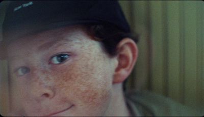 a close up of a person wearing a hat