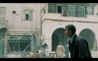 a man standing in front of a building