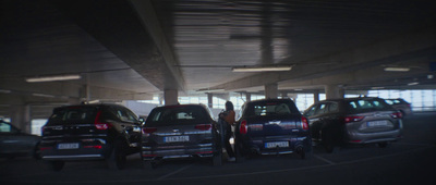 a group of cars parked in a parking garage