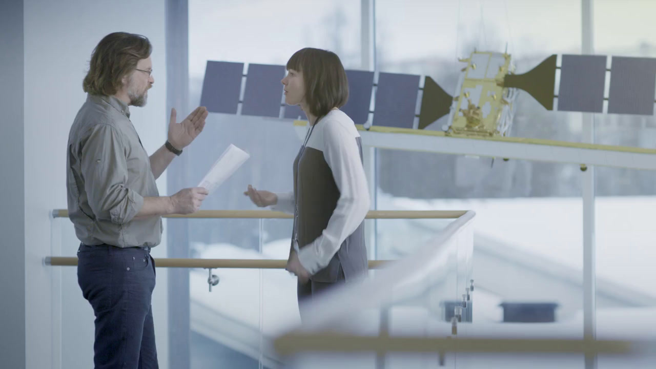 a man and a woman standing next to each other