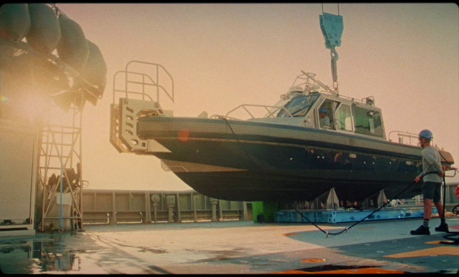 a man standing in front of a boat