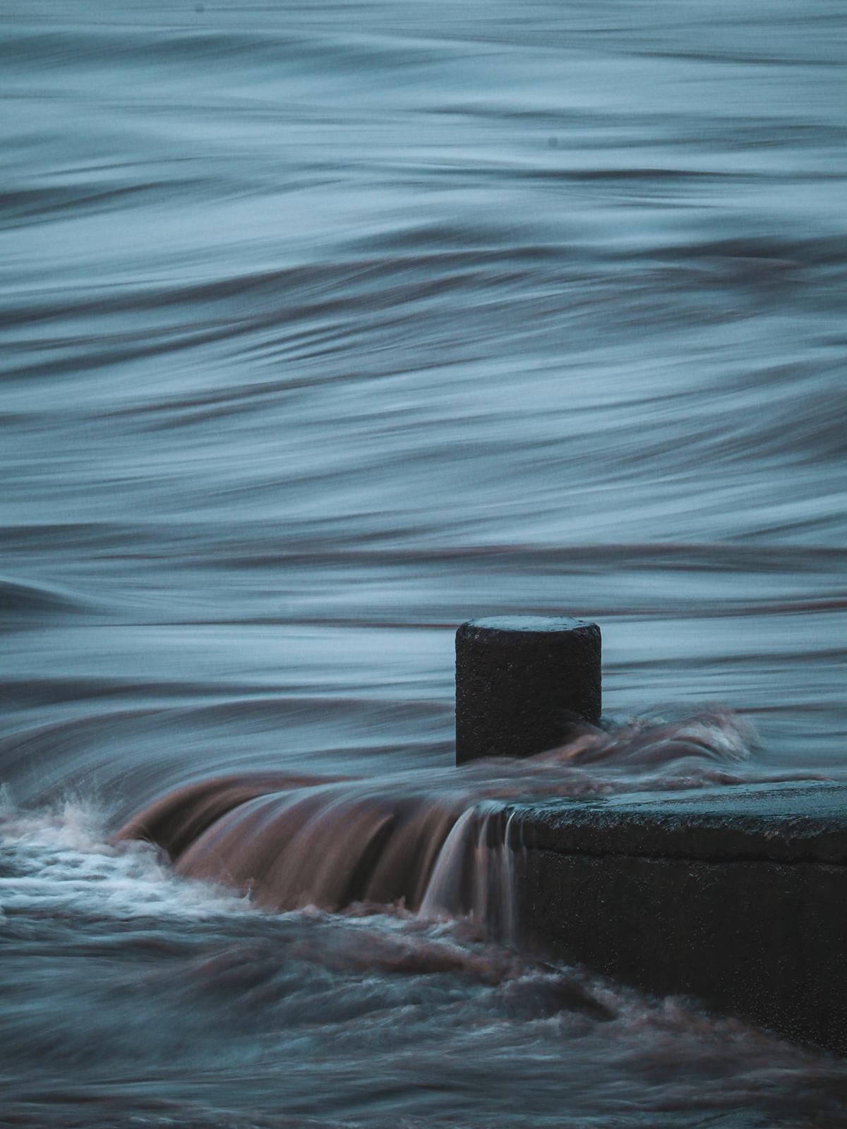 a buoy sitting in the middle of a body of water