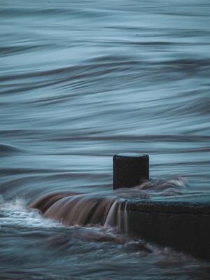 a buoy sitting in the middle of a body of water