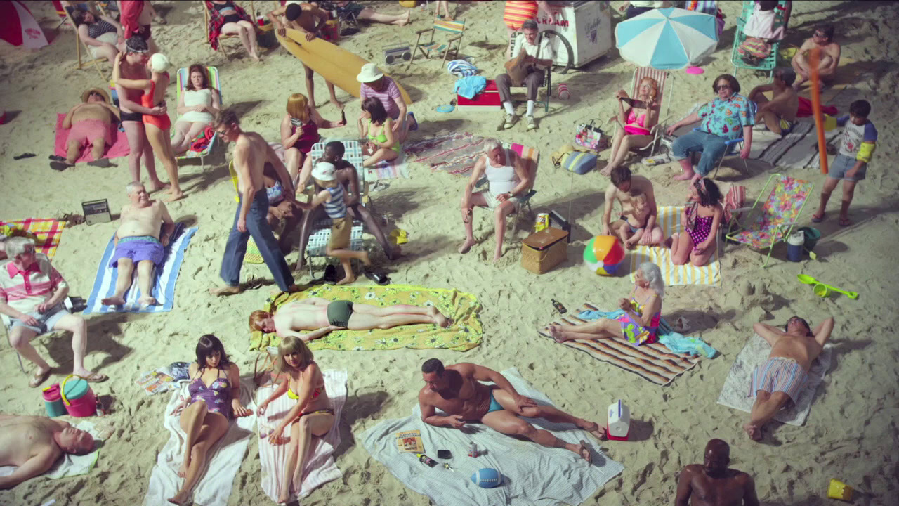 a large group of people on a beach