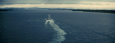 a large boat traveling across a large body of water