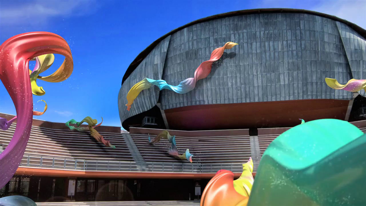 a large building with a lot of colorful objects in front of it