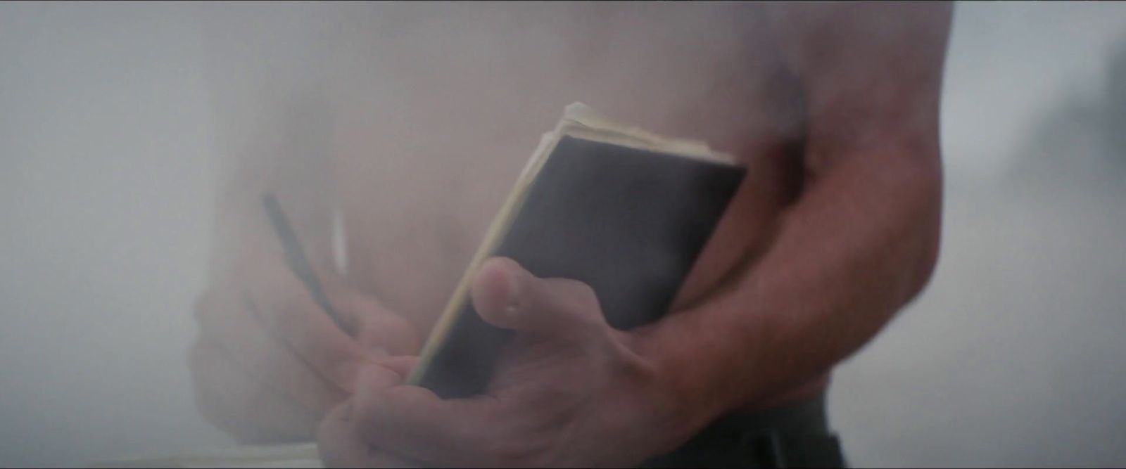 a person holding a book in their hands