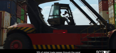 a forklift with a man standing on top of it